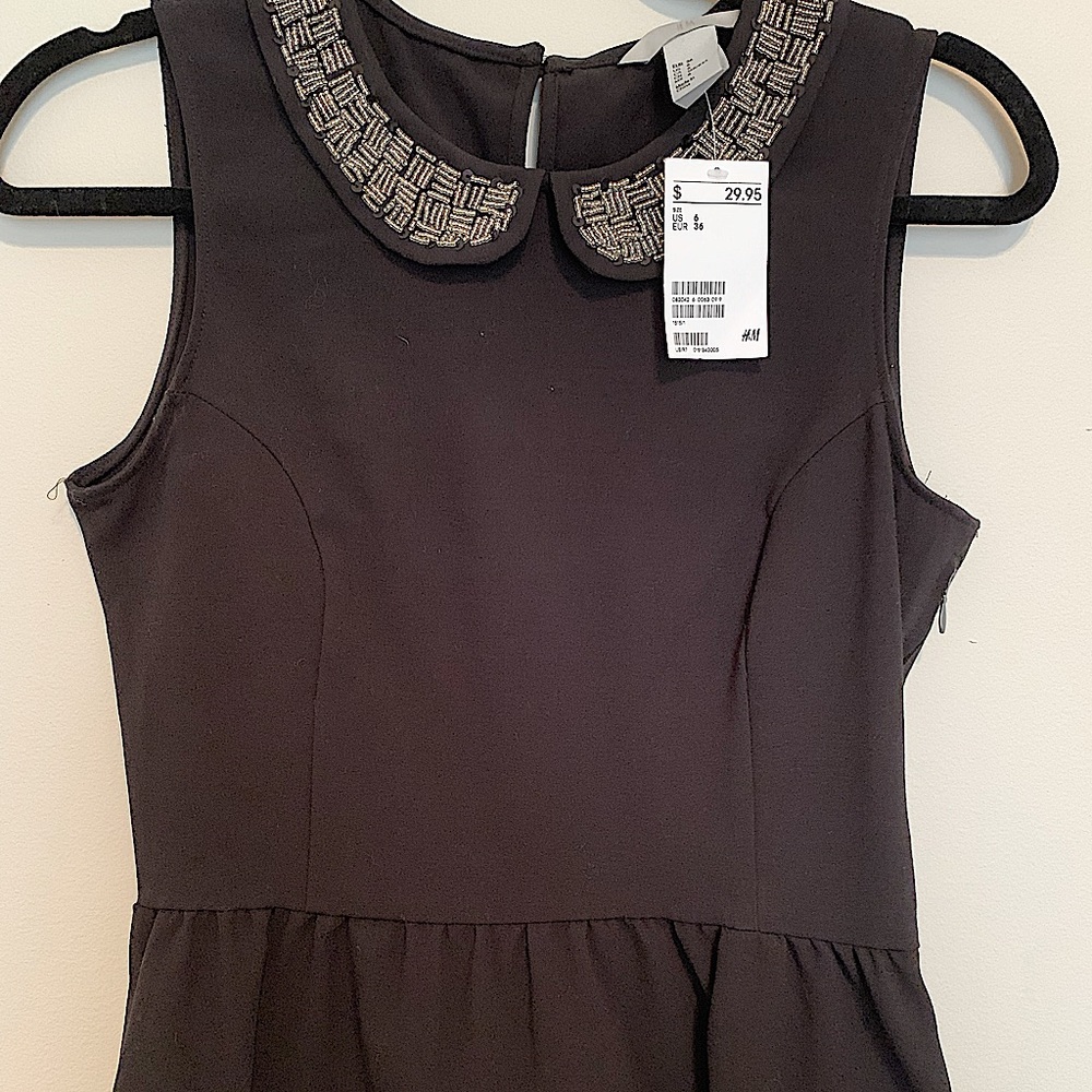 Embellished black peplum top